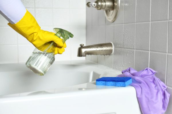 cleaning-a-bathroom-bathtub-and-shower-combination-2026-01-09-00-37-13-utc